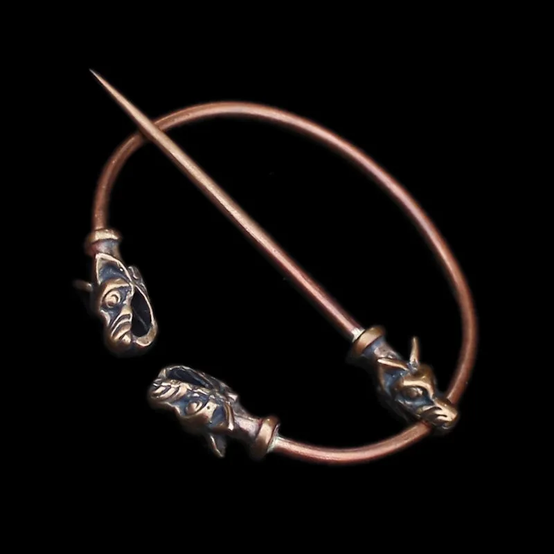 Bronze Penannular Brooch with Icelandic Wolf Heads